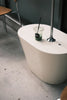 Discover the Unique Design Benefits of Bespoke Concrete Sinks with the Green Concave Namibian Dream Sink