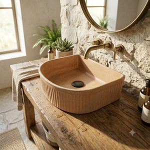 Bathroom vanity with terracotta sink, wooden cabinet, and decorative elements.